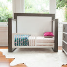 Shop the mid century toddler bed conversion kit from the TRUE collection by Milk Street Baby.